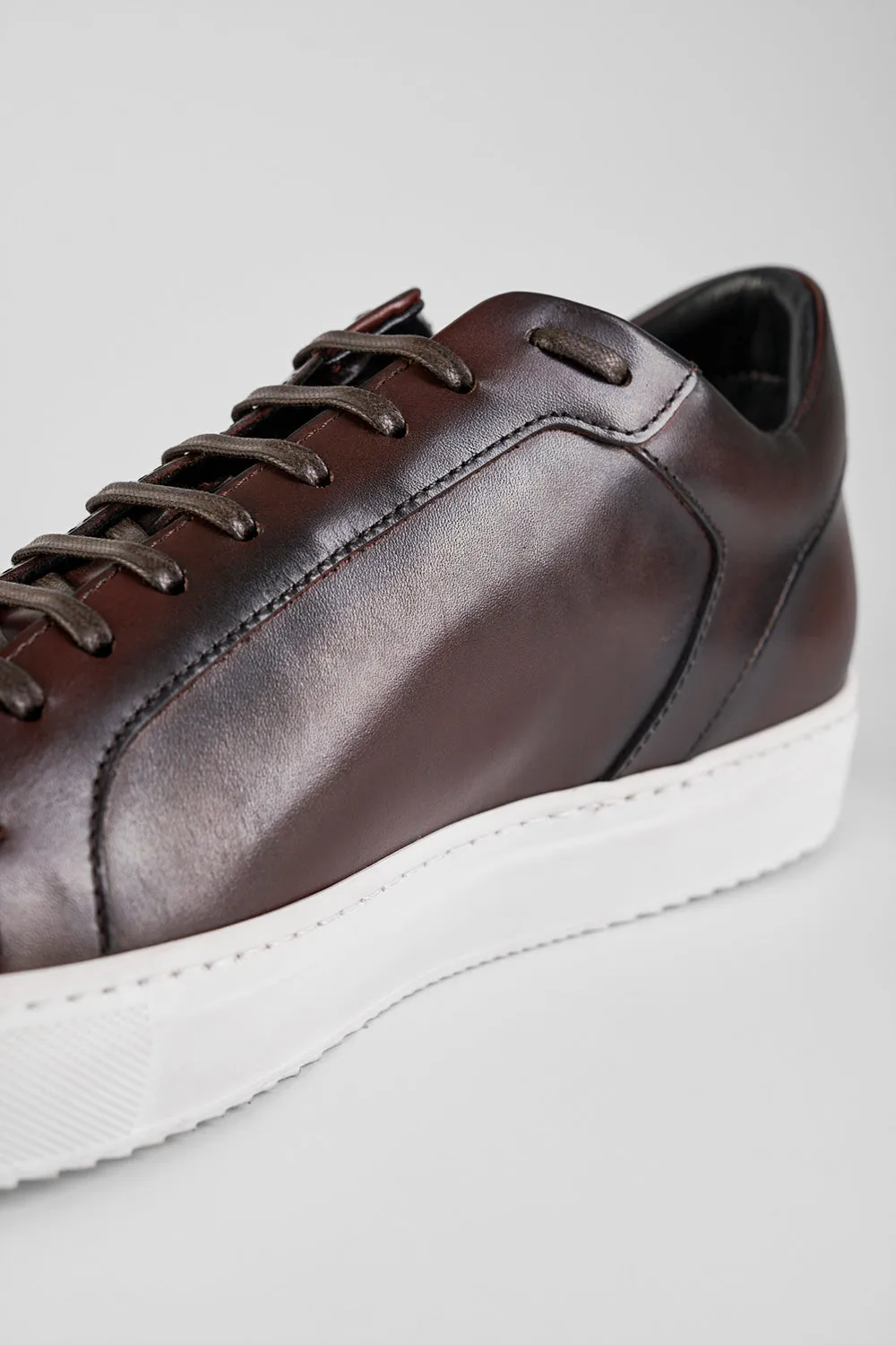 SOHO chestnut patina sneakers.