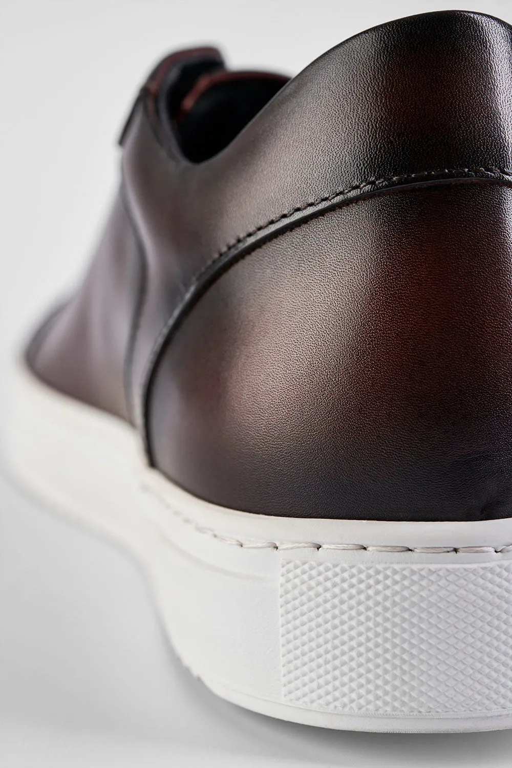 SOHO chestnut patina sneakers.