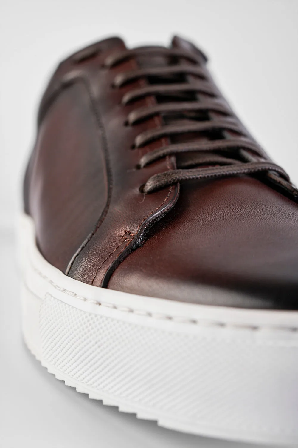 SOHO chestnut patina sneakers.